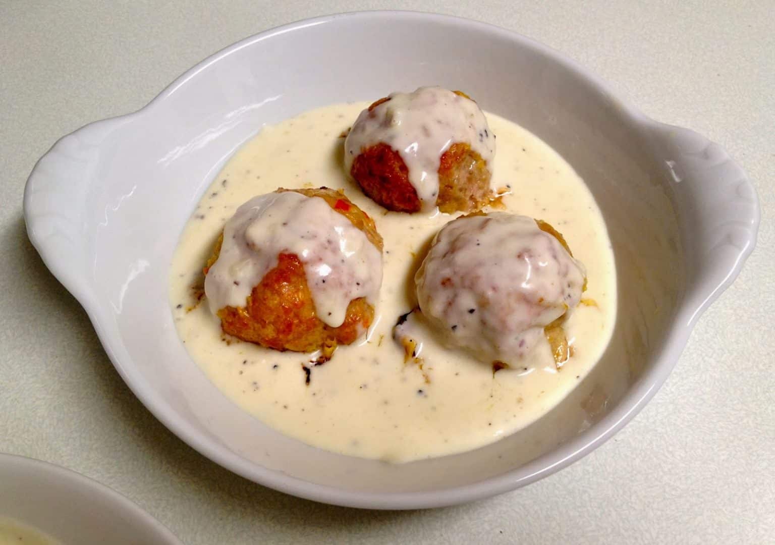 The Meatball Shop’s Spicy Pork Meatballs with Parmesan Cream Sauce