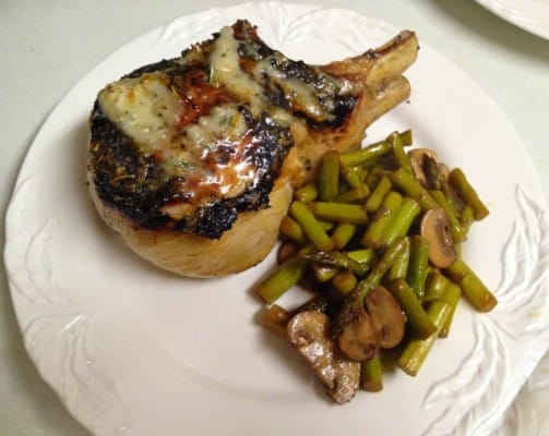 Double Cut Pork Chops with Roasted Garlic Butter and a side of Stir Fried Asparagus and Mushrooms