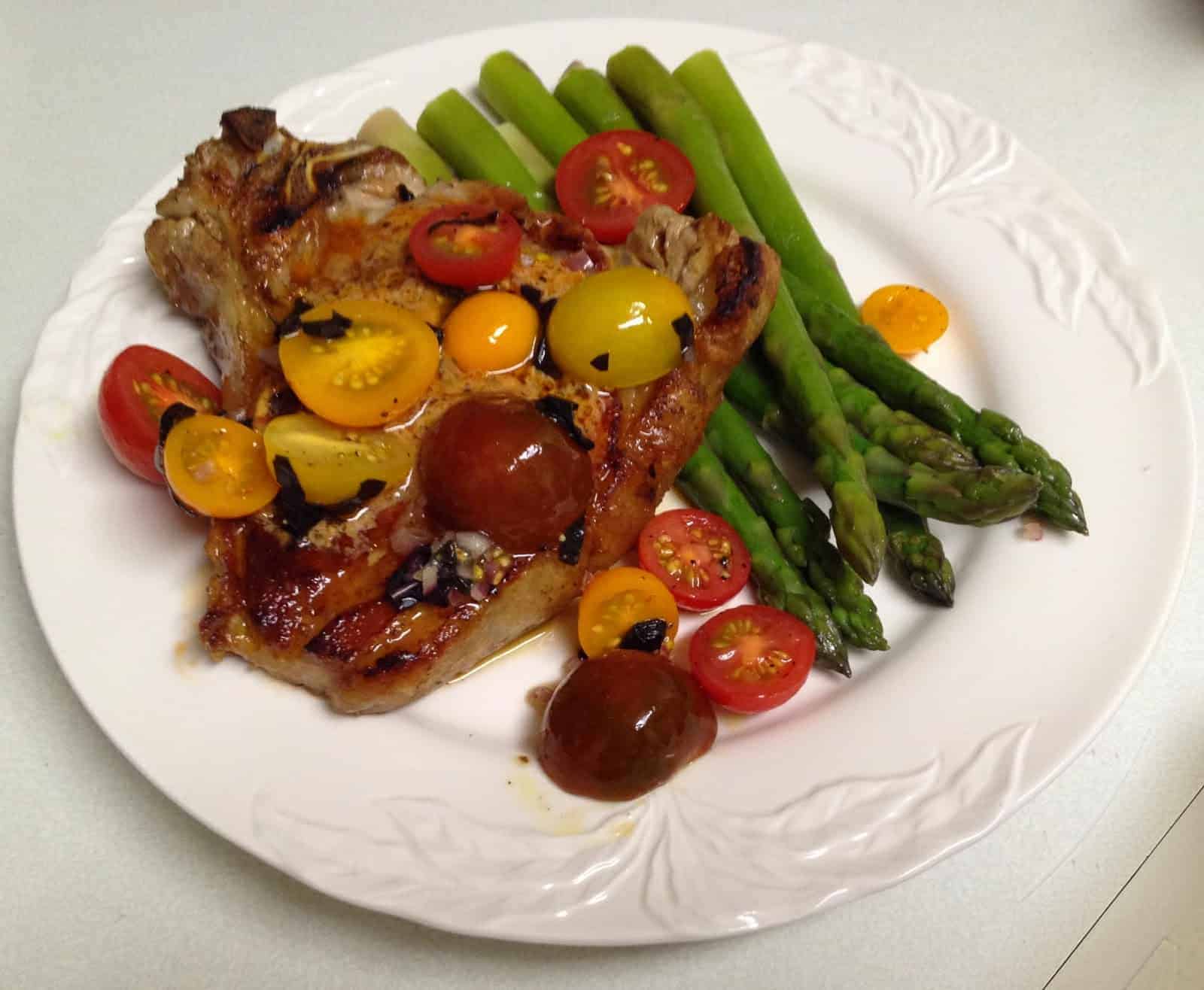 Pan-Grilled Veal Chops with Tomato-Blue Cheese Butter and Cherry Tomato Salad from Bruce Aidells’ "The Great Meat Cookbook"