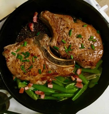Melissa Clark’s Seared Pork Chops with Peas, Scallions and Pancetta from "Dinner: Changing the Game", her brand new cookbook.