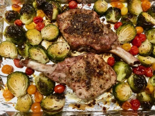 Sheet Pan Dinner: Cumin Pork Chops with Maple-Glazed Brussels Sprouts and Tiny Tomatoes.