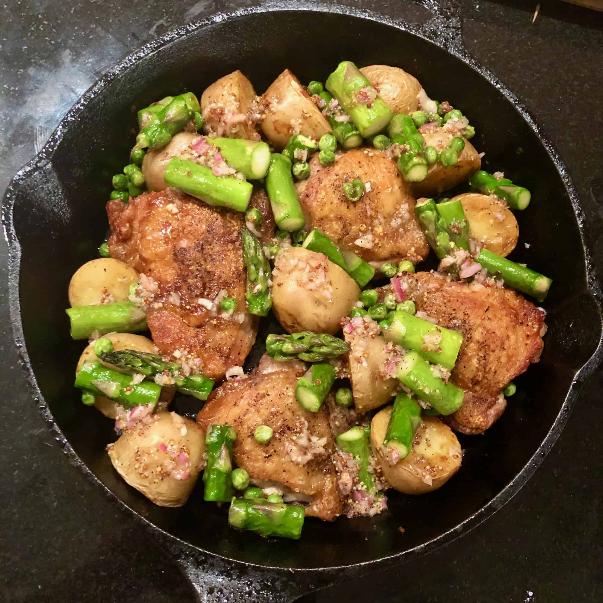 One Skillet Chicken Thighs, Potatoes and Summer Vegetables with a