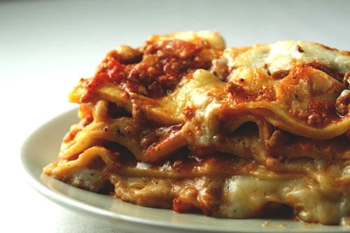 A cross-section of the world's best lasagna shows layers of pasta, bechamel sauce and bolognese ragu.
