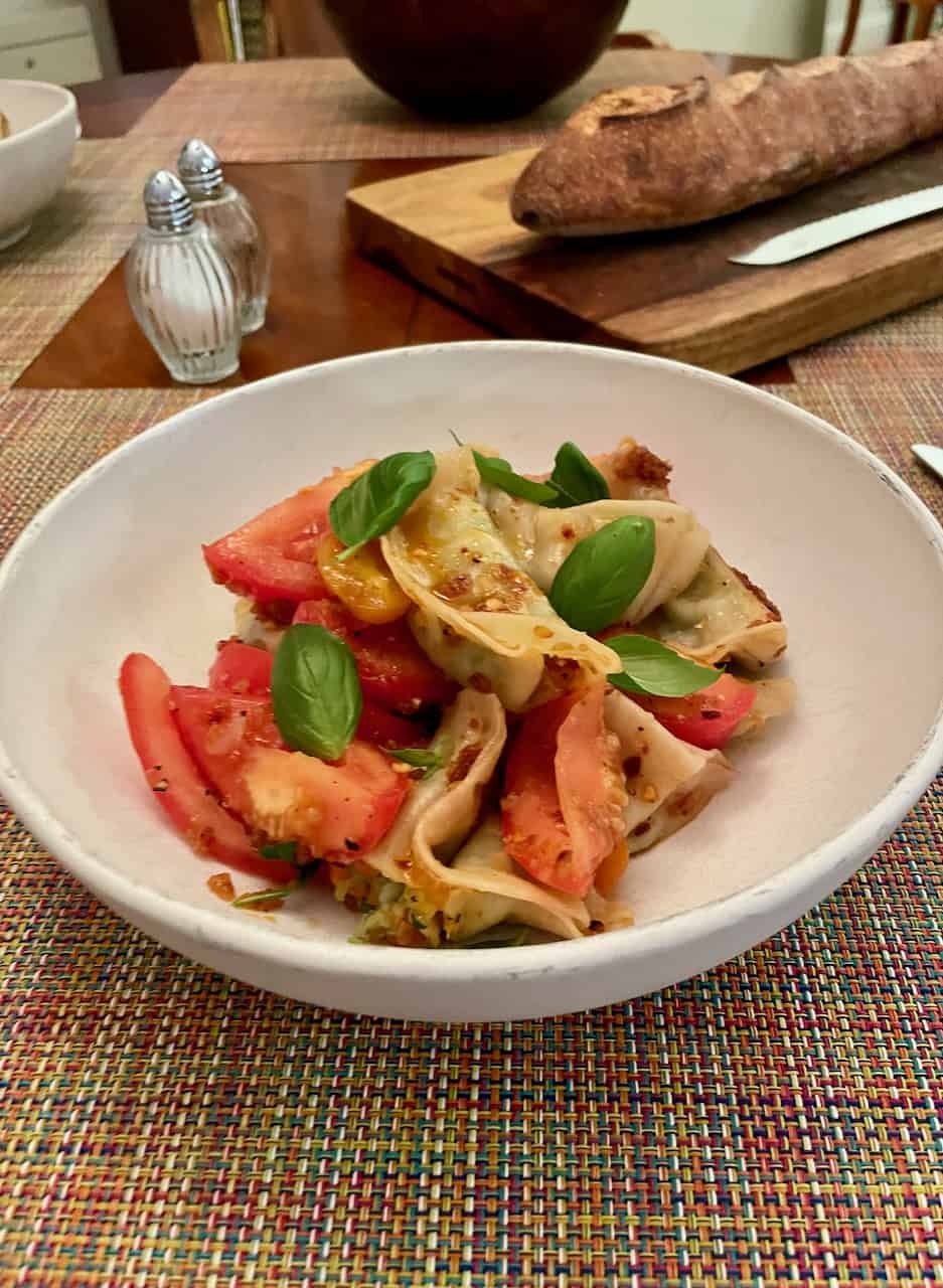 ﻿﻿DUMPLING TOMATO SALAD WITH CHILI CRISP VINAIGRETTE