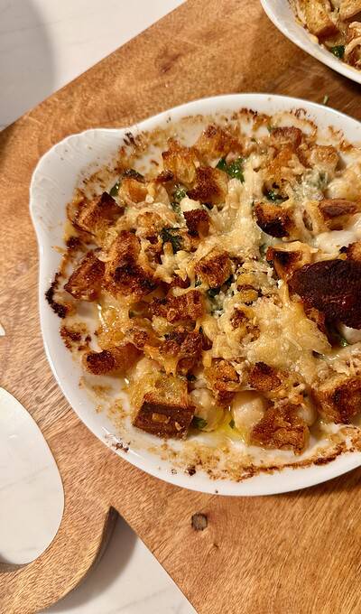 BAKED BAY SCALLOPS WITH HOT-SAUCE BUTTER, PARMESAN AND CROUTONS.