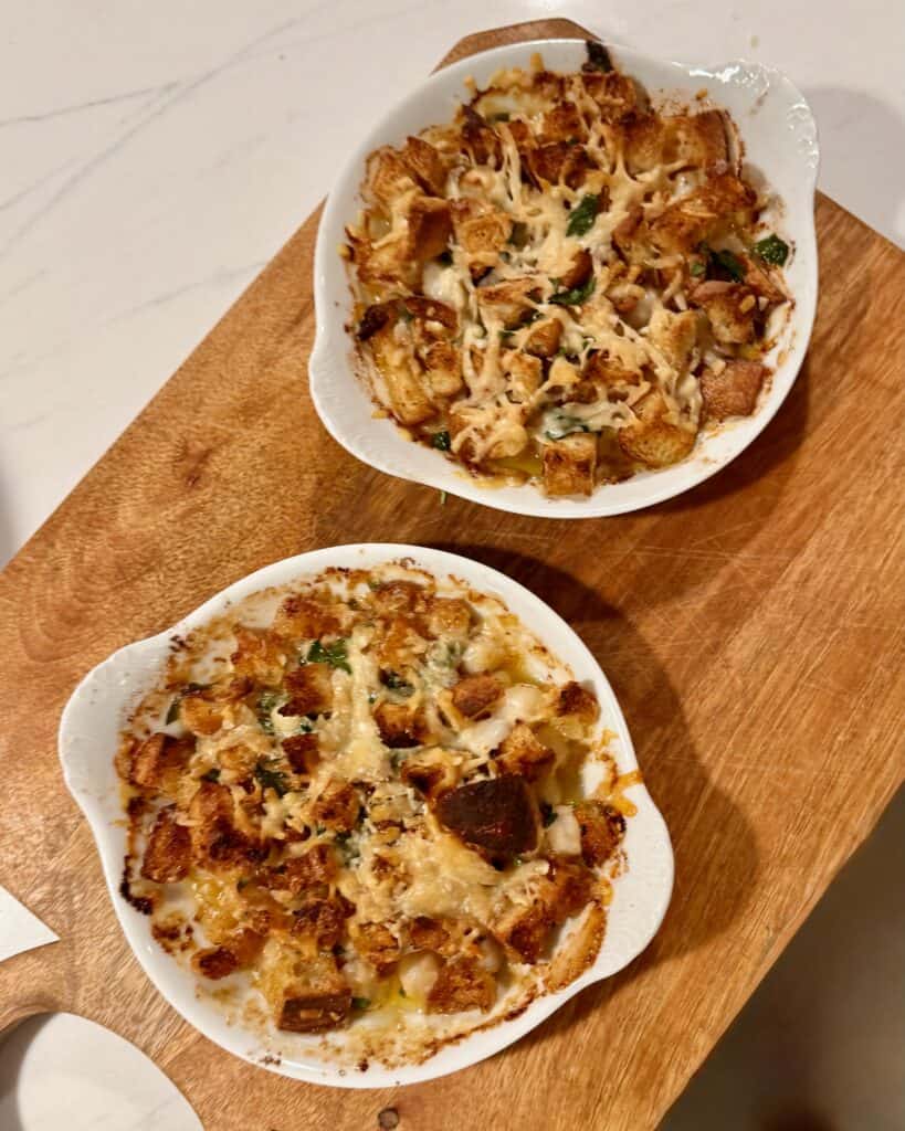 Individual servings of baked bay scallops with buttery croutons.