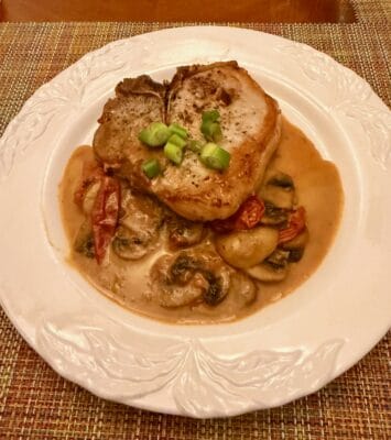 PORK CHOPS WITH TOMATOES, MUSHROOMS AND PISTACHIO CREAM