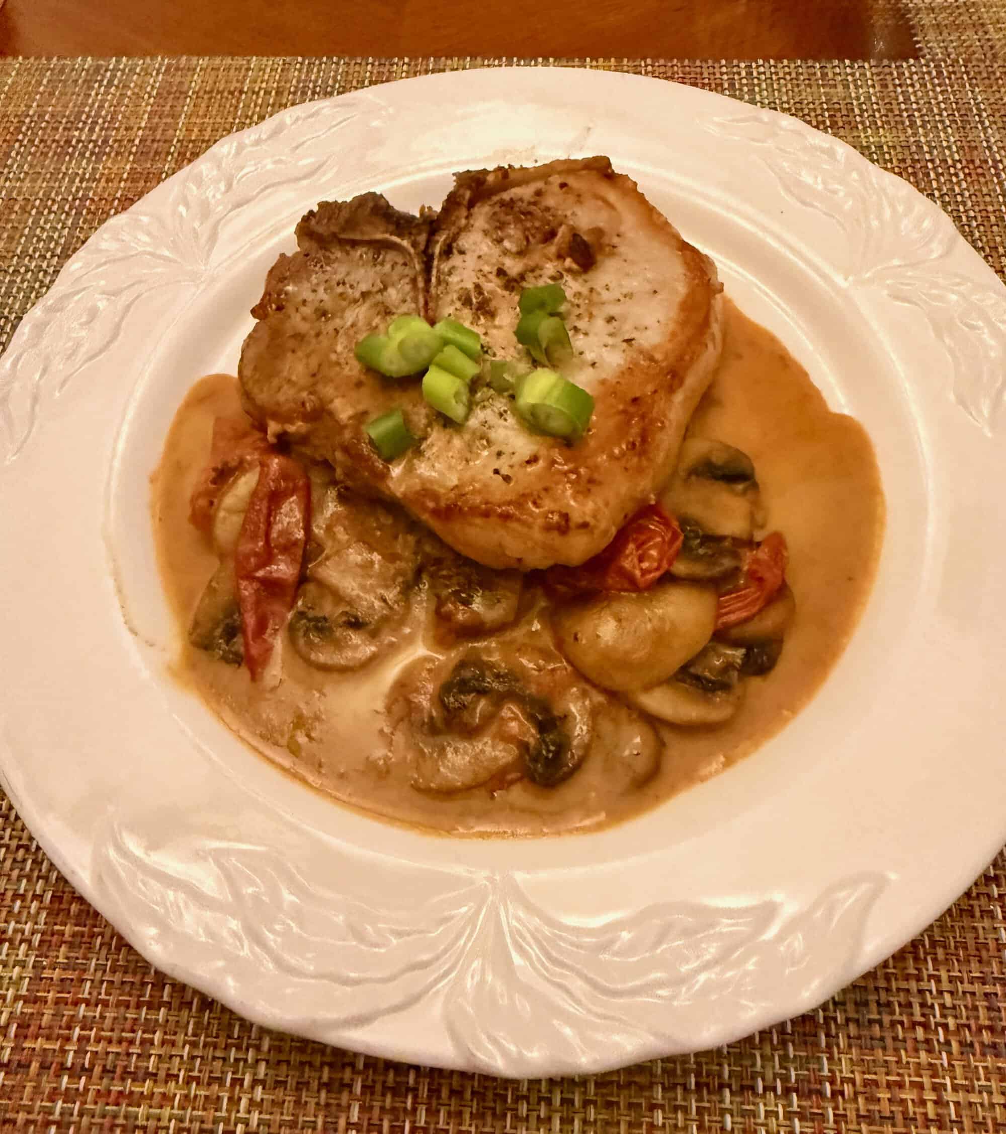 PORK CHOPS WITH TOMATOES, MUSHROOMS AND PISTACHIO CREAM